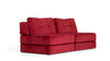 Rotes Stoffsofa von Desede Switzerland mit weichen Kissen und modernem Design.