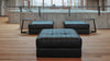 Schwarze Lederhocker von Desede Switzerland in modernem Design, ideal für stilvolle Lounges.