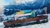 Buntes Ledersofa von Desede Switzerland vor schneebedeckter Berglandschaft platziert.