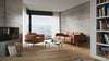 Braunes Ledersofa und Sessel von Desede Switzerland in modernem Wohnzimmerambiente.