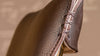 Brauner Lederstuhl mit handgenähter Naht von Desede Switzerland, edles Design-Detail.