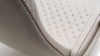 Detailaufnahme eines beigen Ledersessels von Desede Switzerland mit eleganter Steppung.