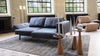 Schwarzes Ledersofa von Desede Switzerland mit verstellbarer Rückenlehne neben beigem Relaxsessel.