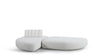 Modulares Stoffsofa in Creme von Desede Switzerland mit gepolsterter Rückenlehne und geschwungenem Design.