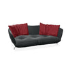 Schwarzes Ledersofa mit roten Kissen von Desede Switzerland, ideal für stilvolle Wohnzimmer.
