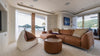 Braunes Ledersofa von Desede Switzerland mit passendem Hocker in modernem Wohnzimmer.